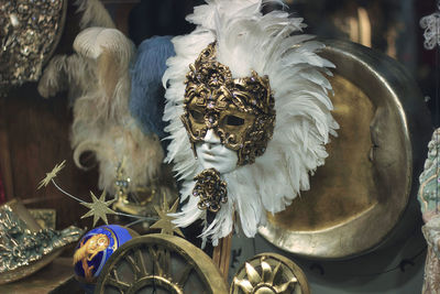 Venice, italy - venetian colorful carnaval masks exposed and displayed on a table in a mask shop