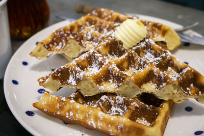 Waffles with icing sugar , close up