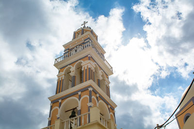 Low angle view of clock tower against sky