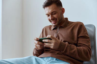 Young man using mobile phone