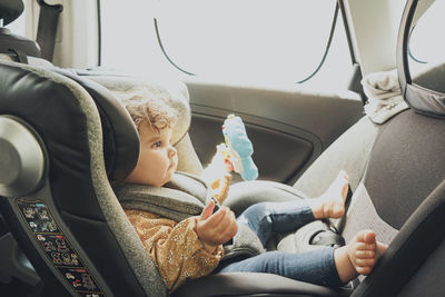 Portrait of boy sitting in car