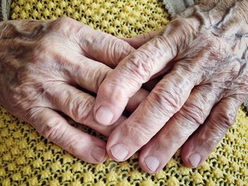 Close-up of woman hands clasped