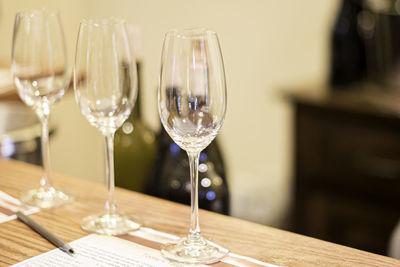 Close-up of wine glasses on table