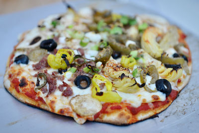 Close-up of pizza served on table