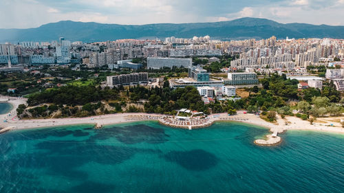 High angle view of buildings by sea