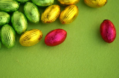 Close-up of candies against green background