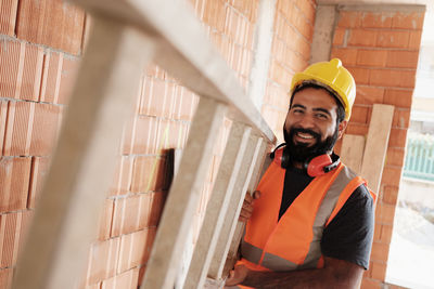 Portrait of man working at construction site