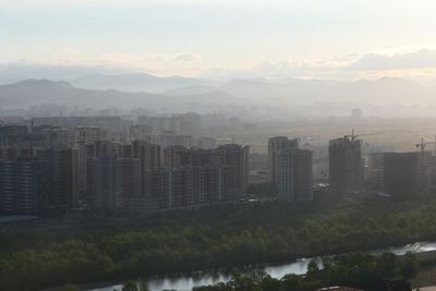 Buildings in city against sky