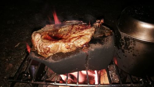 Close-up of meat on barbecue grill