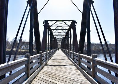 Footbridge against clear sky