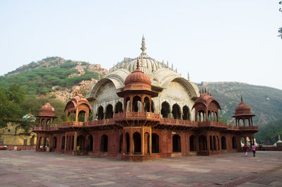 Facade of historic building against clear sky