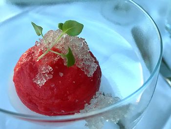 Close-up of strawberry on ice cream in plate