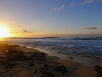 Scenic view of sea against sky during sunset