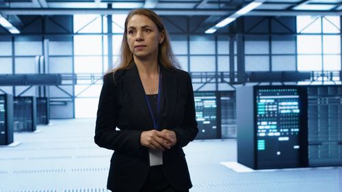Portrait of young woman standing in airport