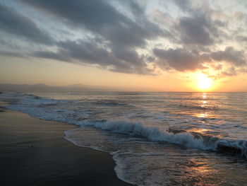 Scenic view of sea against sky during sunset