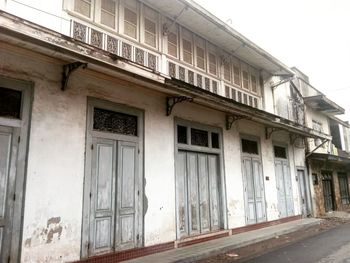 Low angle view of old building against sky