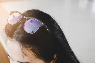 Close-up portrait of woman wearing sunglasses