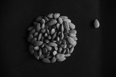 Directly above shot of candies on table against black background