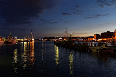 Sailboats in river at night