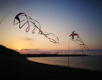 Scenic view of beach against sky during sunset