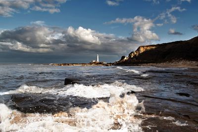 Scenic view of beach and sea against sky