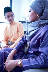 Husband and wife sharing during the eid celebration