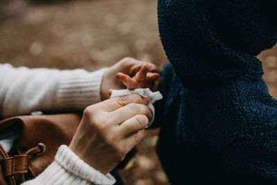 Close-up of couple holding hands