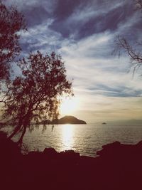Scenic view of sea against cloudy sky