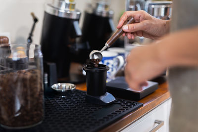 Cropped hands of man working at table