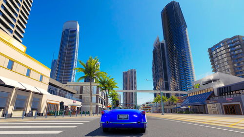 Buildings in city against blue sky