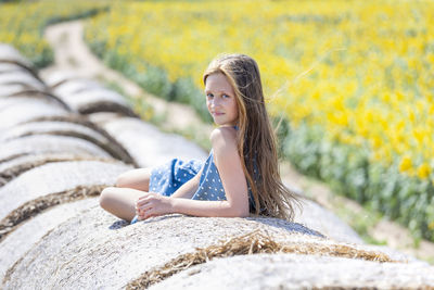 Portrait of teenage girl sitting outdoors