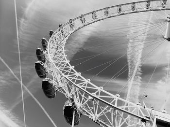 Low angle view of ferris wheel against sky