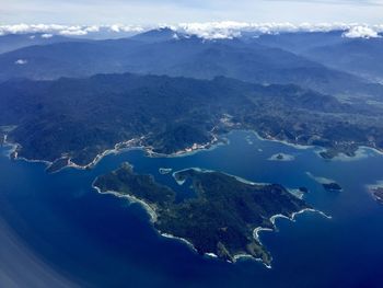 Aerial view of mountain range against sky