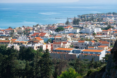 High angle view of townscape by sea