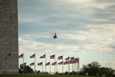 Low angle view of airplane flying against sky