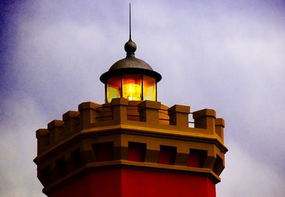 Low angle view of building against cloudy sky