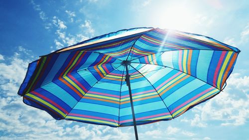 Low angle view of umbrella on sunny day