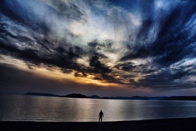 Scenic view of sea against cloudy sky