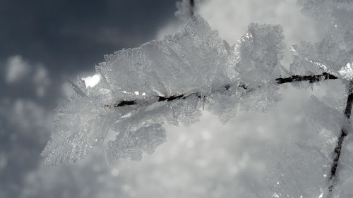 Aerial view of snow covered mountain against sky