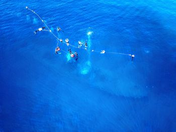 High angle view of people swimming in pool