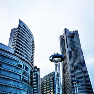 Low angle view of modern buildings against sky in city