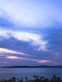 Scenic view of lake against cloudy sky