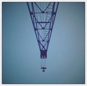 Low angle view of cables against clear sky