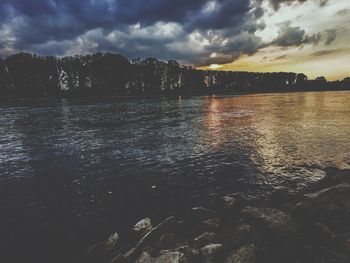 Scenic view of sea against cloudy sky