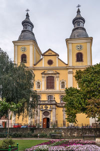 Facade of historic building against sky