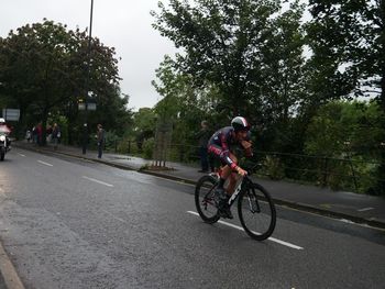 Man riding bicycle on road