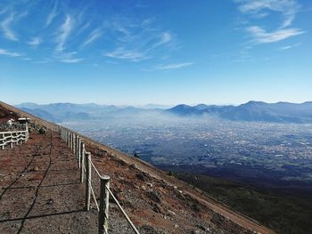 Scenic view of mountains against blue sky