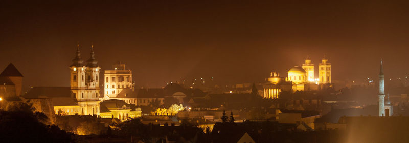 High angle view of city lit up at night