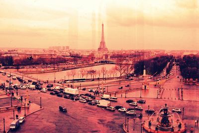 Eiffel tower against sky at sunset