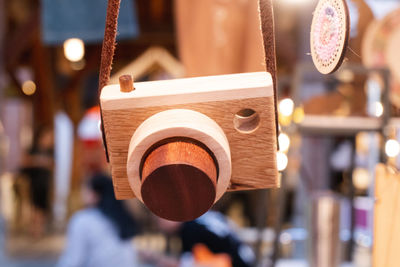 Close-up of electric lamp hanging in market